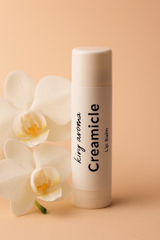 Creamicle lip balm with a white orchid on a beige background, kiry aroma.