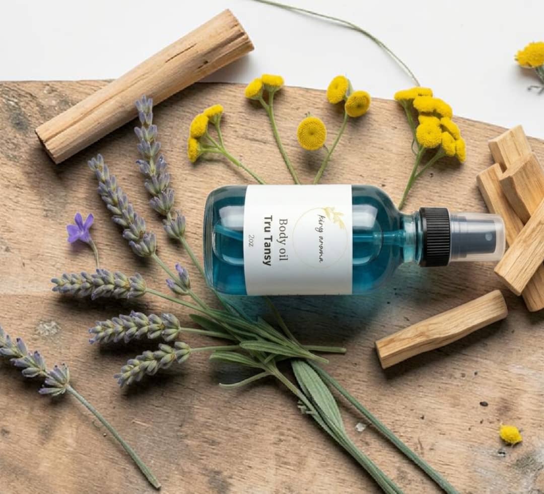 Bottle of Tula Probiotic Skincare on a wooden surface with lavender and flowers